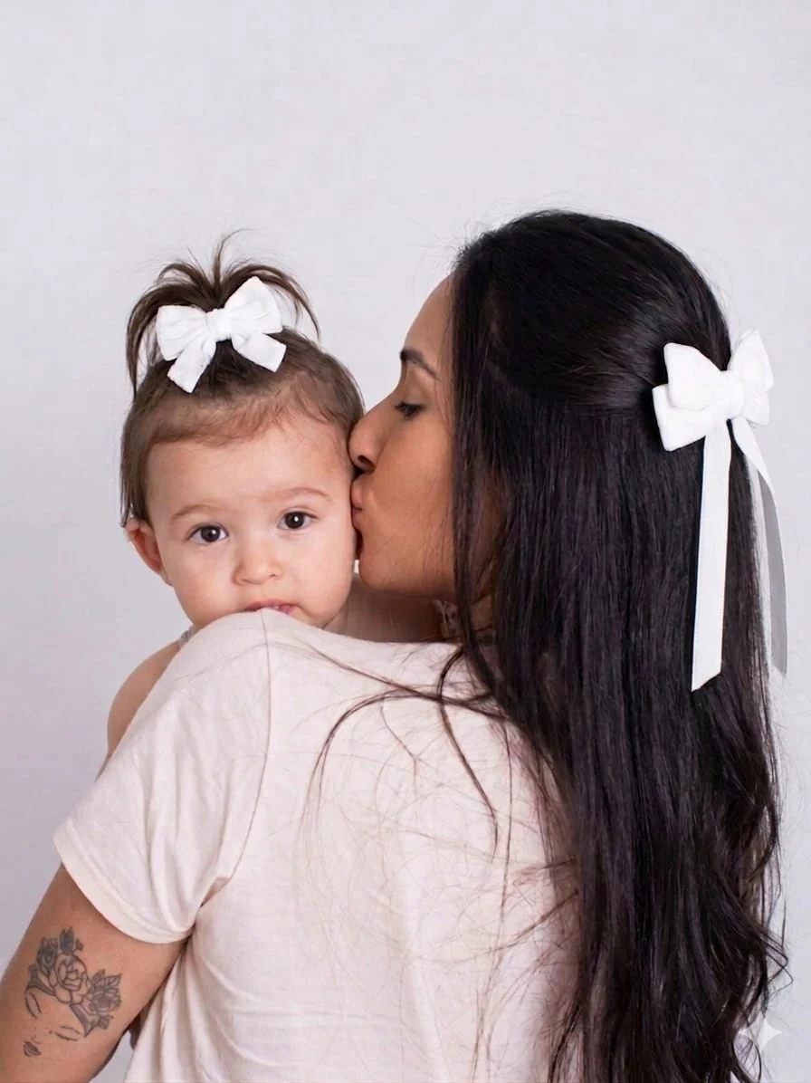 Acessórios combinando mãe e filha